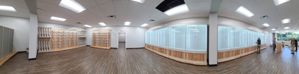 Empty+retail+space+glass+locking+shelves+and+gun+warden
