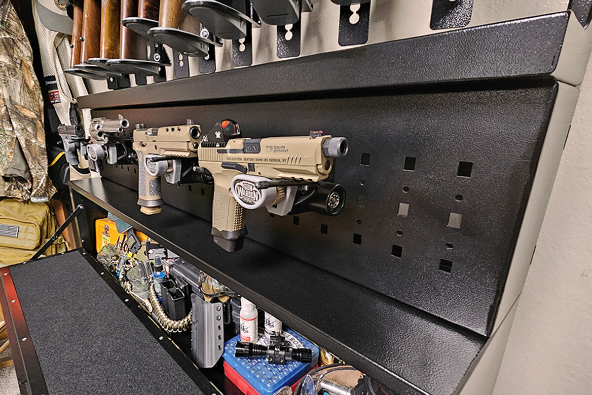 A gun rack displaying multiple pistols arranged neatly.