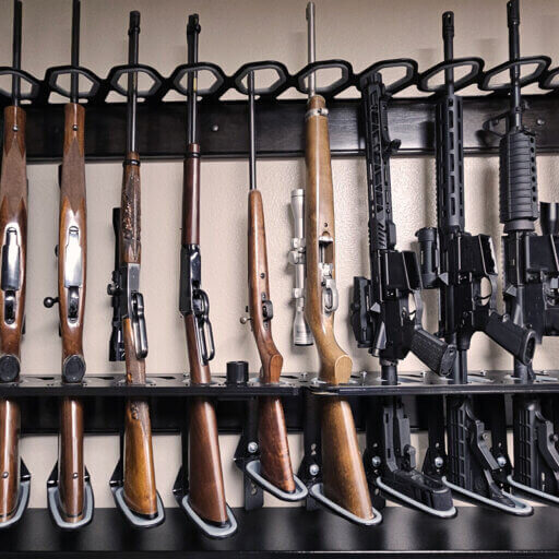 A rack displaying multiple rifles and guns arranged neatly